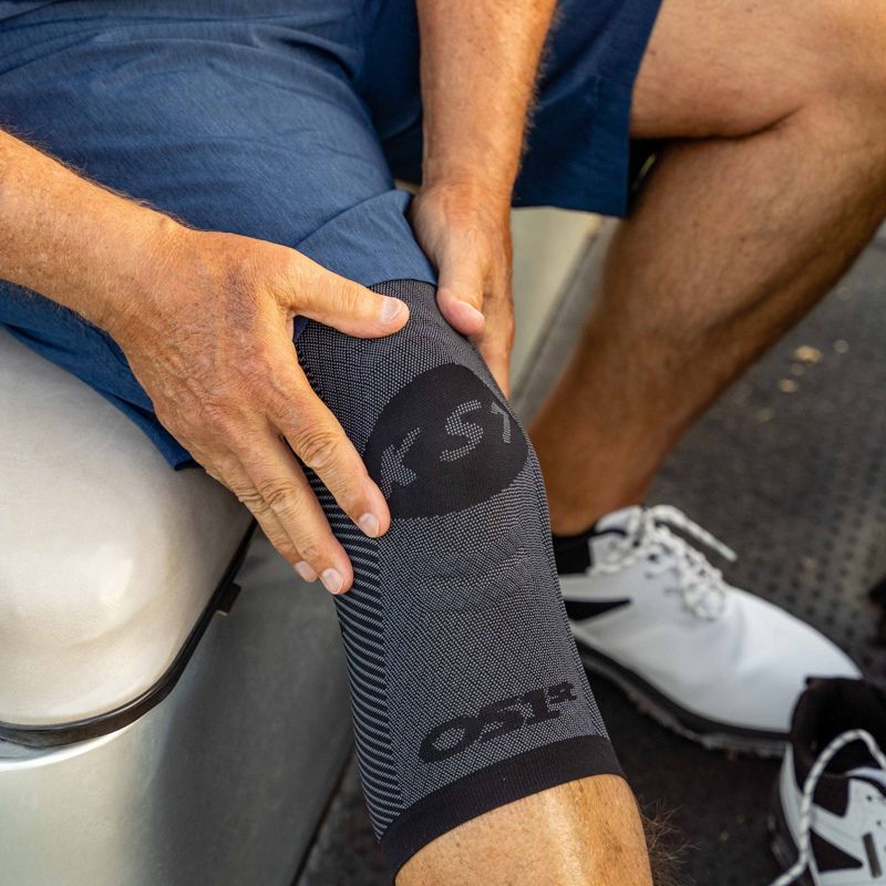 Man wearing the OrthoSleeve Compression Knee Brace while golfing