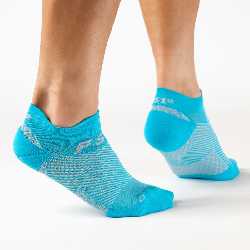 Person wearing the OrthoSleeve aqua no show plantar fasciitis socks