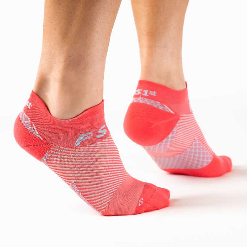 Person wearing the OrthoSleeve coral no show plantar fasciitis socks