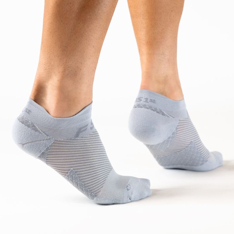 Person wearing the OrthoSleeve grey no show plantar fasciitis socks