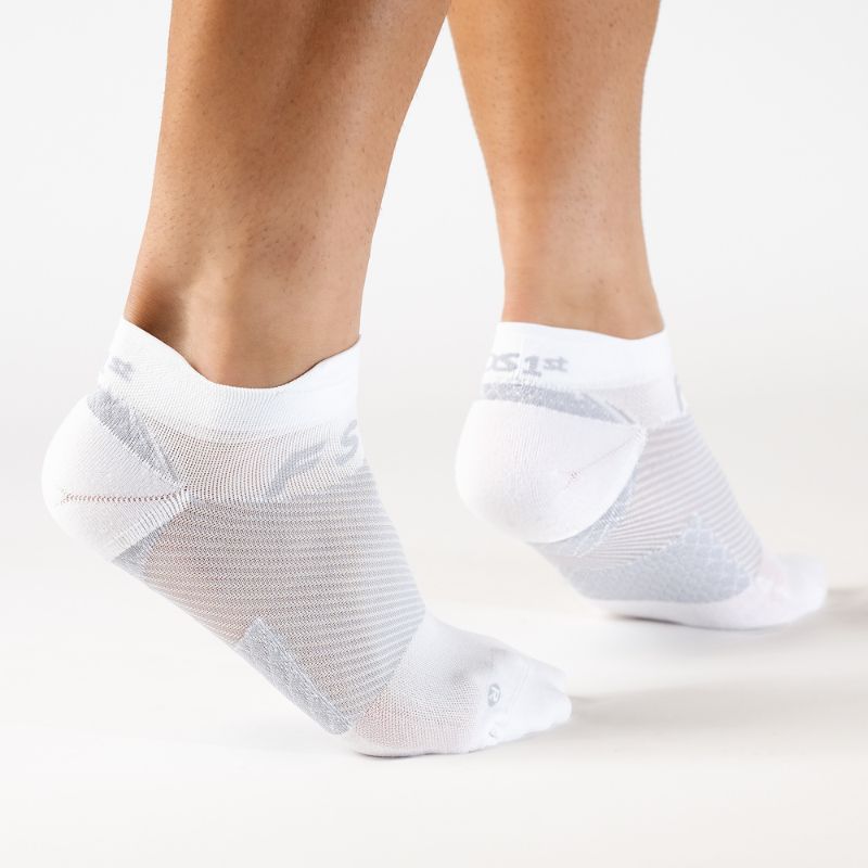 Person wearing the OrthoSleeve white no show plantar fasciitis socks