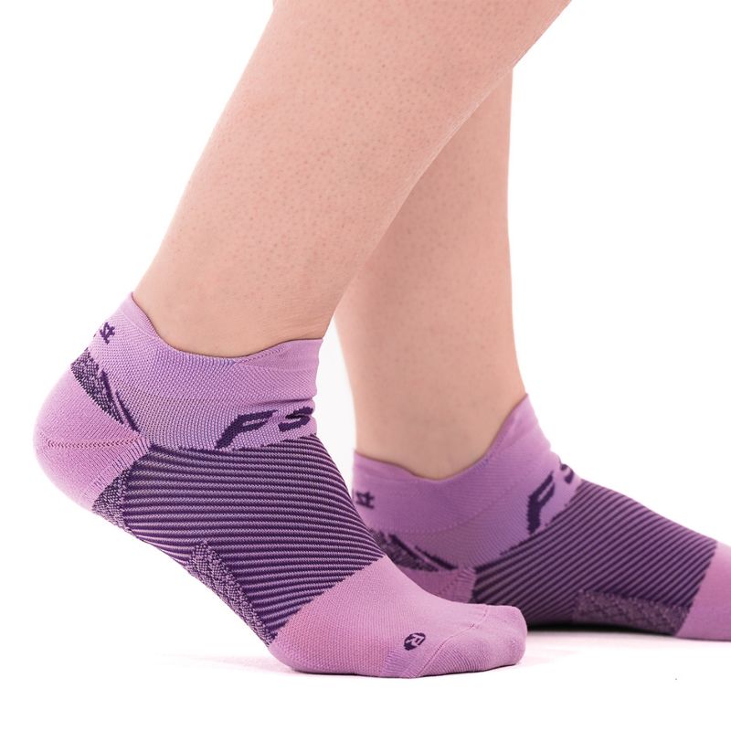 Person wearing the OrthoSleeve lavender no show plantar fasciitis socks
