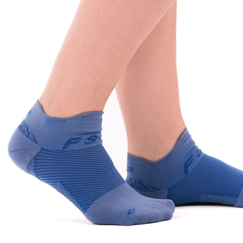 Person wearing the OrthoSleeve steel blue no show plantar fasciitis socks