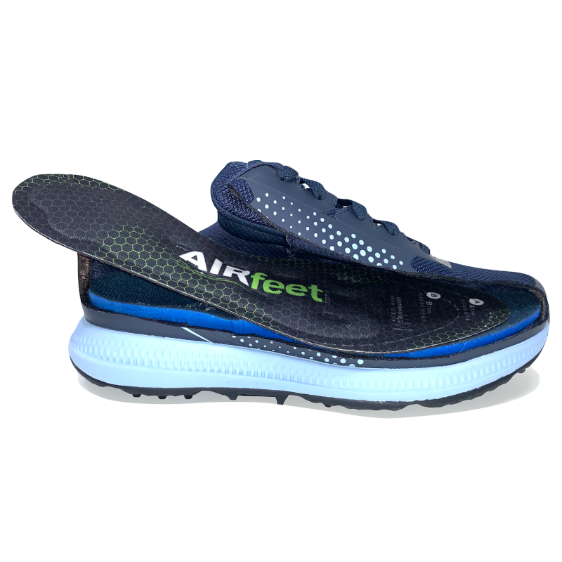 The An AIRfeet Relief O2 insole being placed in a shoe