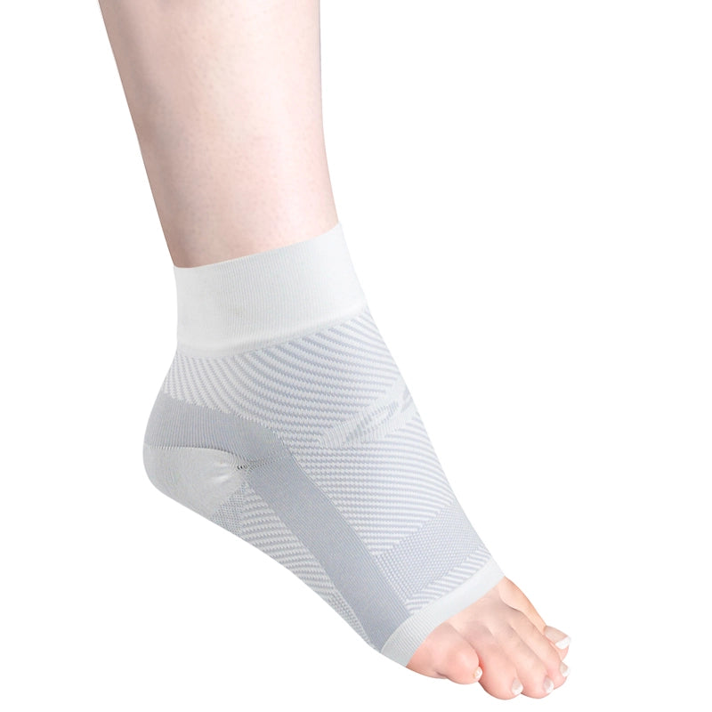 Woman's foot flexed in the night time Plantar Fasciitis sleeve