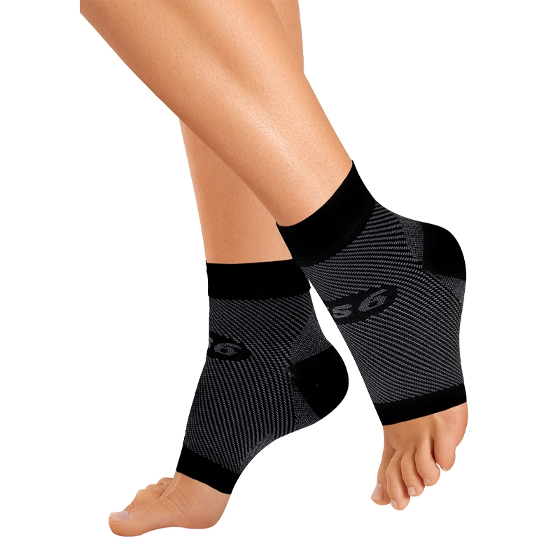 Product photo of black Plantar Fasciitis Sleeves on a woman's feet