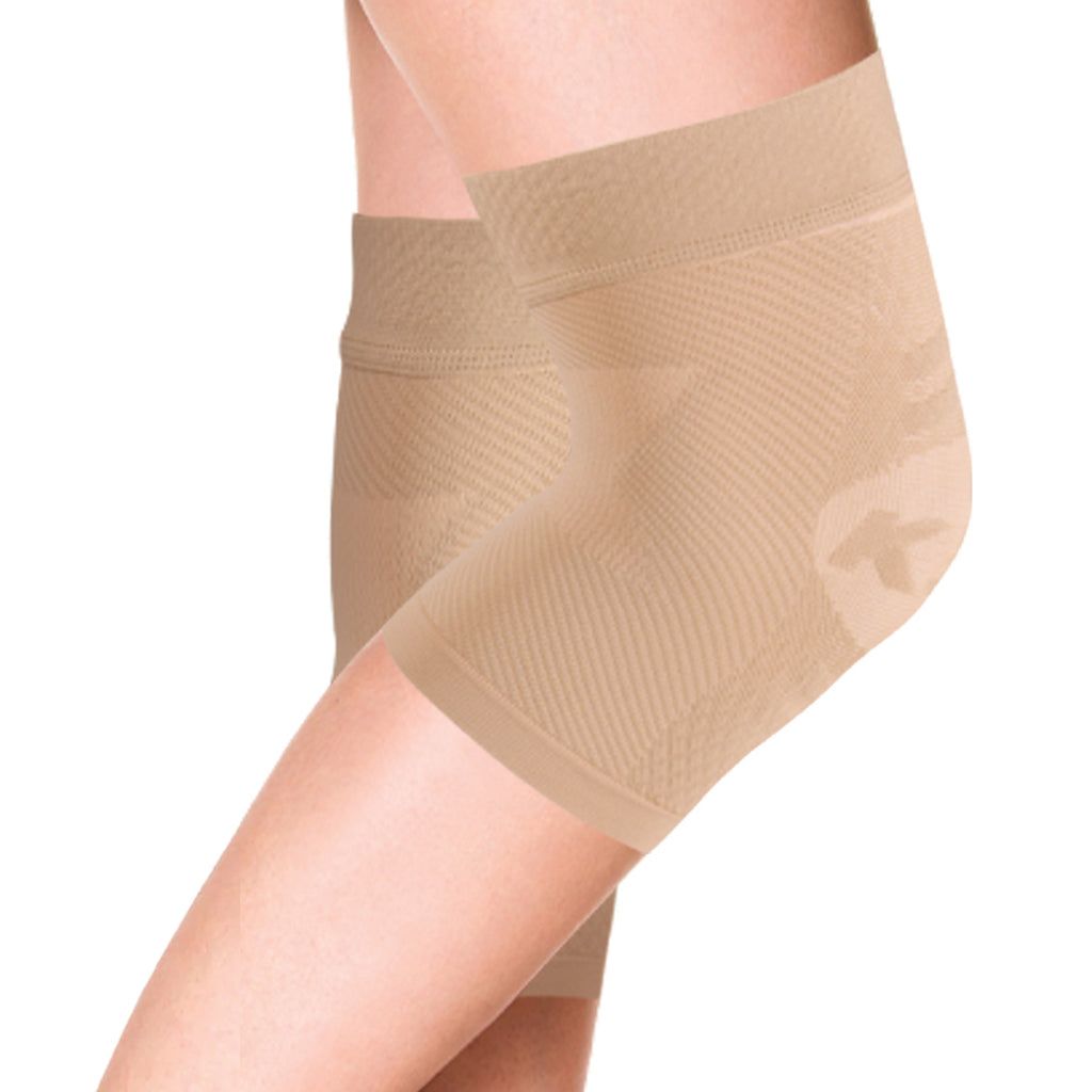 Product image of a pair of tan, compression knee braces on women's legs