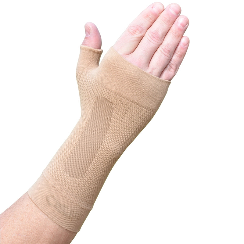 The tan Wrist Compression Sleeve on a man's wrist
