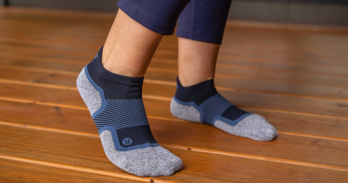 Woman wearing the OrthoSleeve No Show Wellness Care Socks