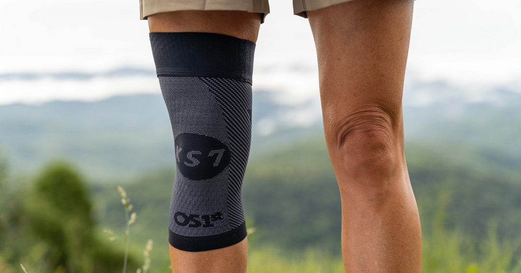 Woman wearing the OrthoSleeve Compression Knee Sleeve while hiking