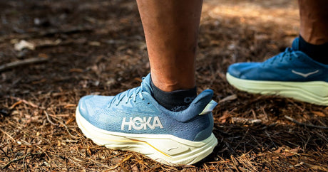Person wearing the OrthoSleeve plantar fasciitis socks while camping outdoors