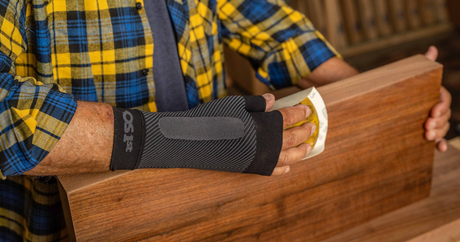 Man wearing the OrthoSleeve Wrist Compression Sleeve