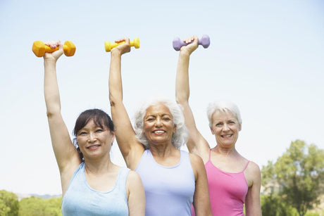 Women in their 40s, 50s, and 60s holding one-point weights over their heads