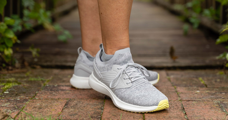 Person wearing the grey no show OrthoSleeve Wellness Care Socks
