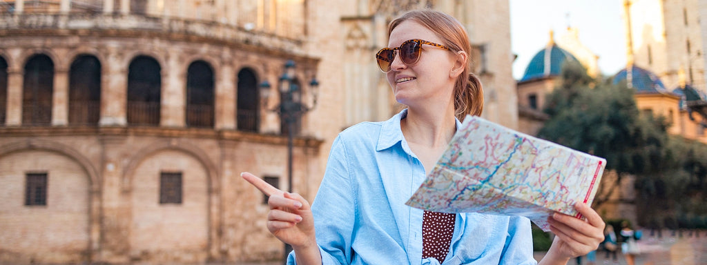 Woman walking around Rome with a map