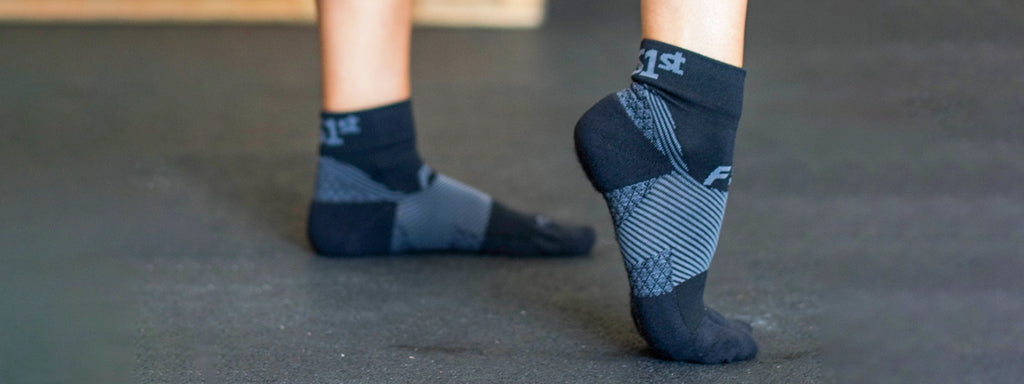 Close up of a person wearing Plantar Fasciitis socks
