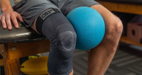 Person wearing the KS8 knee sleeve while doing physical therapy