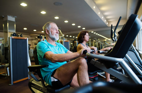 Man working out with machinery in the gym