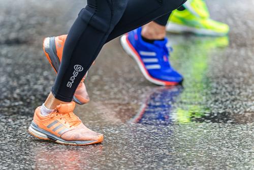 Close up of a runner's feet/shins in action