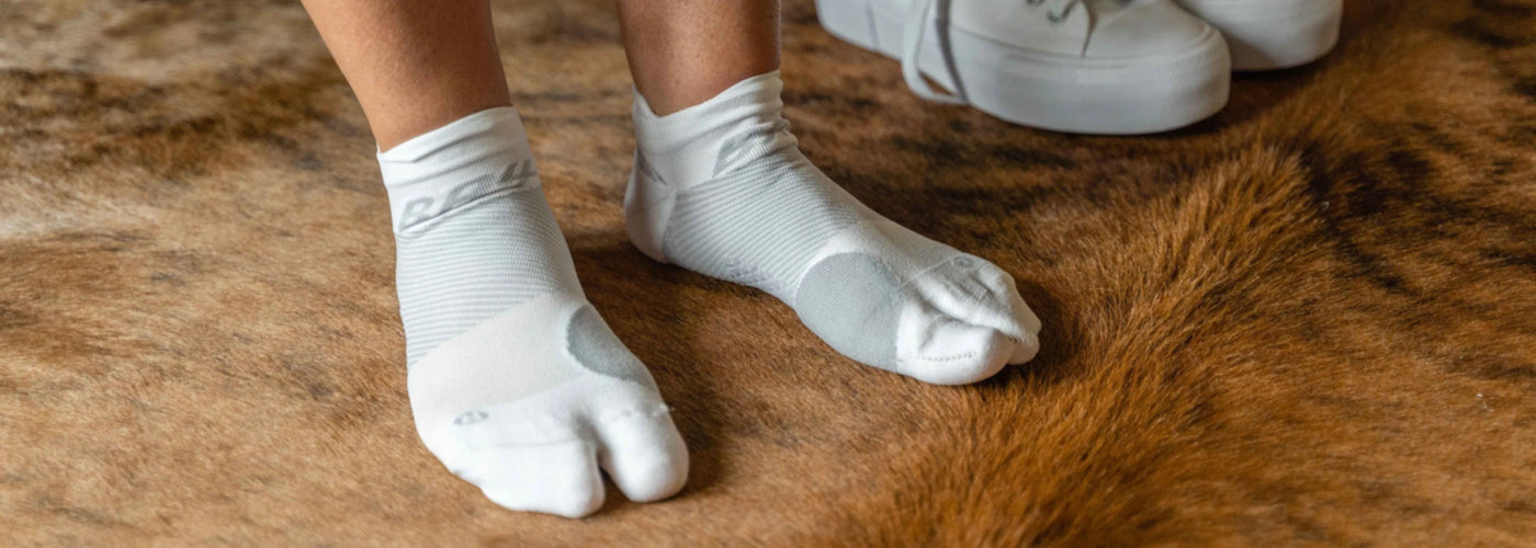 Person wearing OrthoSleeve Bunion Relief Socks