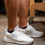 Man wearing a pair of no show OrthoSleeve Wellness Care Socks while working