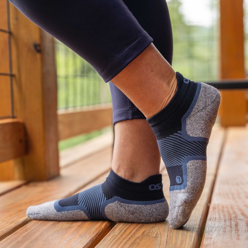 Woman wearing a pair of navy no show Wellness Care Socks