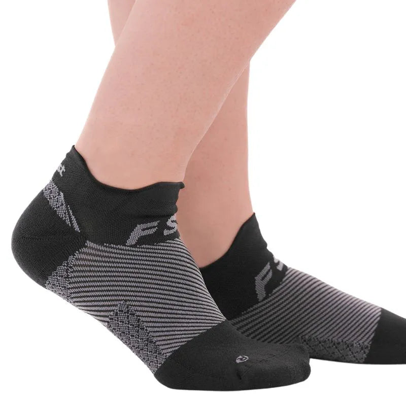 OrthoSleeve black no show plantar fasciitis socks on feet