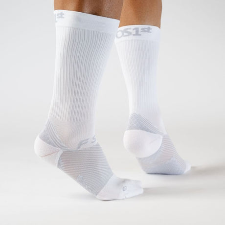 Person wearing the OrthoSleeve white crew length plantar fasciitis socks