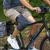 Man riding a bike while wearing the OrthoSleeve KS8 Knee Brace.