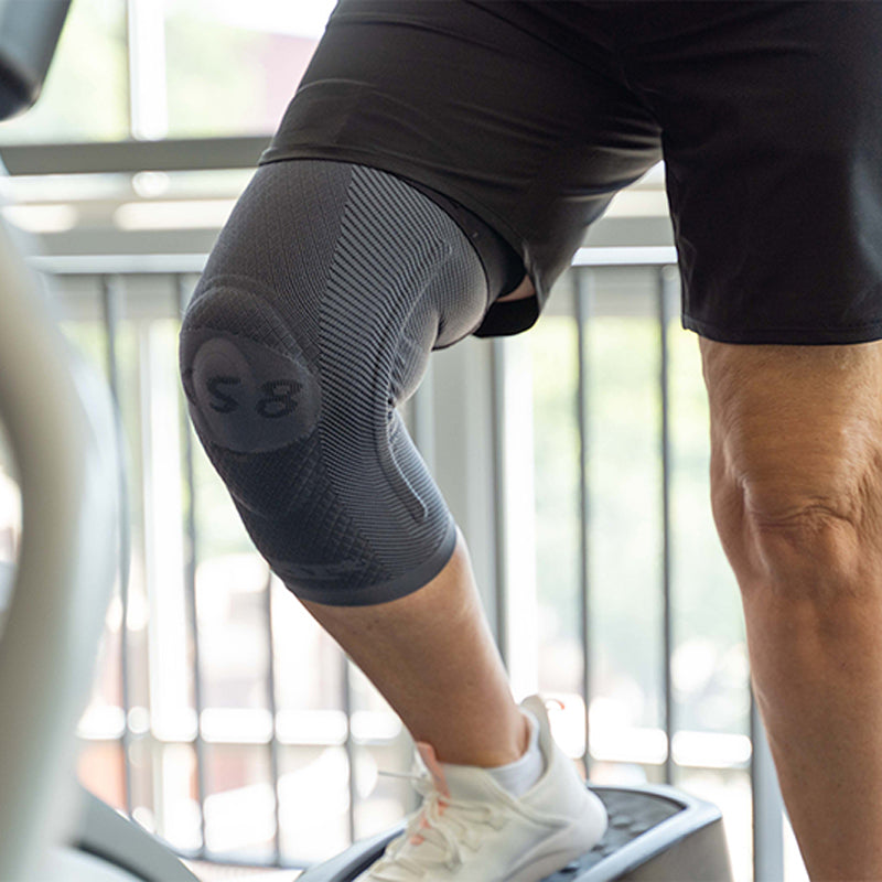 Woman exercising while wearing the OrthoSleeve KS8 Knee Brace. 