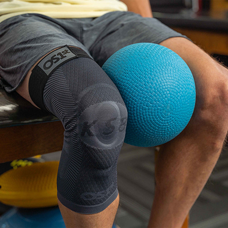 Man completing physical therapy exercises while wearing the OrthoSleeve KS8 Knee Brace. 