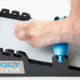 Someone using The Foot Gym Elite for a foot massage