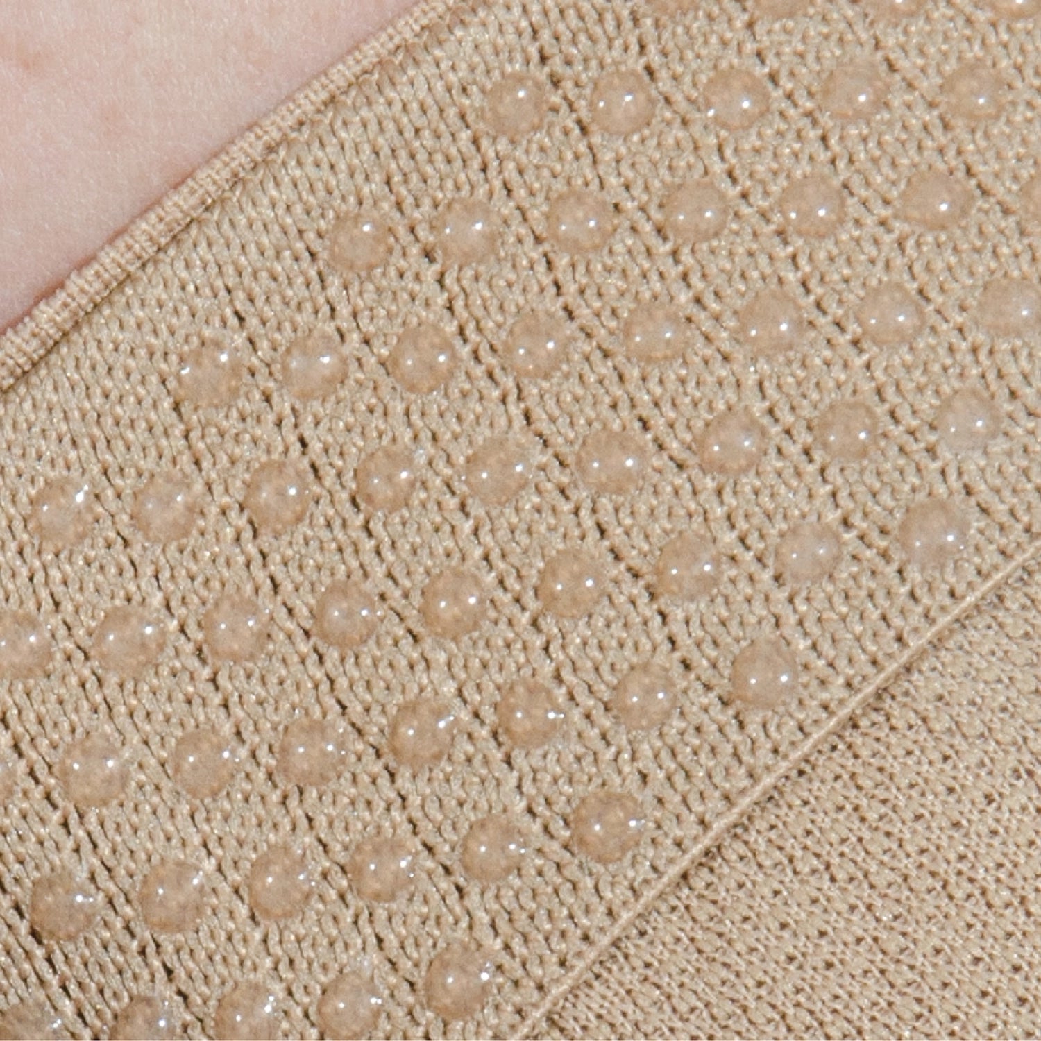 Close up image of the hypo-allergenic silicone grip to keep the bunion brace in place