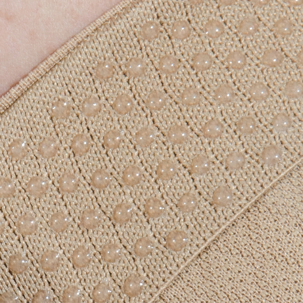 Close up image of the hypo-allergenic silicone grip to keep the bunion brace in place