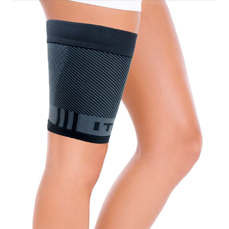 Image of a woman wearing the thigh quad iliotibial band brace