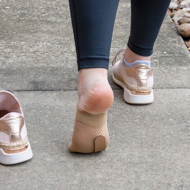 Woman wearing the TT3 Turf Toe Brace while walking