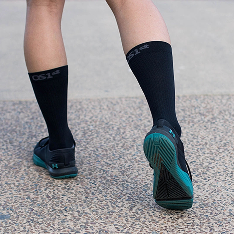 Image of a man wearing the Wellness Care Diabetic and Neuropathy Non-Binding Wellness Socks in Black Crew