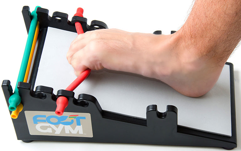man using the tow curl on the foot gym
