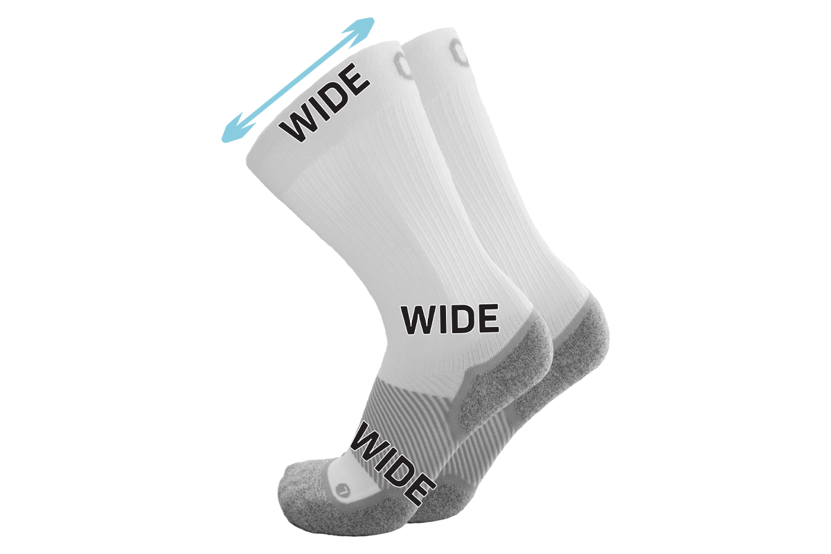 A pair of the wide crew wellness care socks in white
