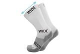 A pair of the wide crew wellness care socks in white