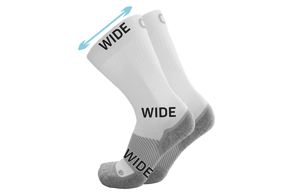 A pair of the wide crew wellness care socks in white