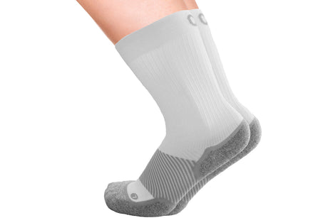 A pair of the wide crew wellness care socks in white